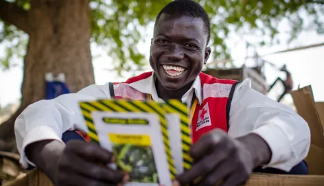 South Sudan Red Cross volunteer A South Sudan Red Cross volunteer shows seeds given out to women farmers in rural South Sudan to improve agriculture and food production in the onset of the rainy season.