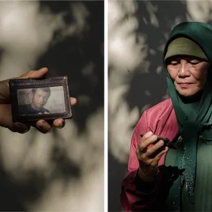 Gloria Berden holding her missing son's wallet Gloria Berden holding her missing son's wallet