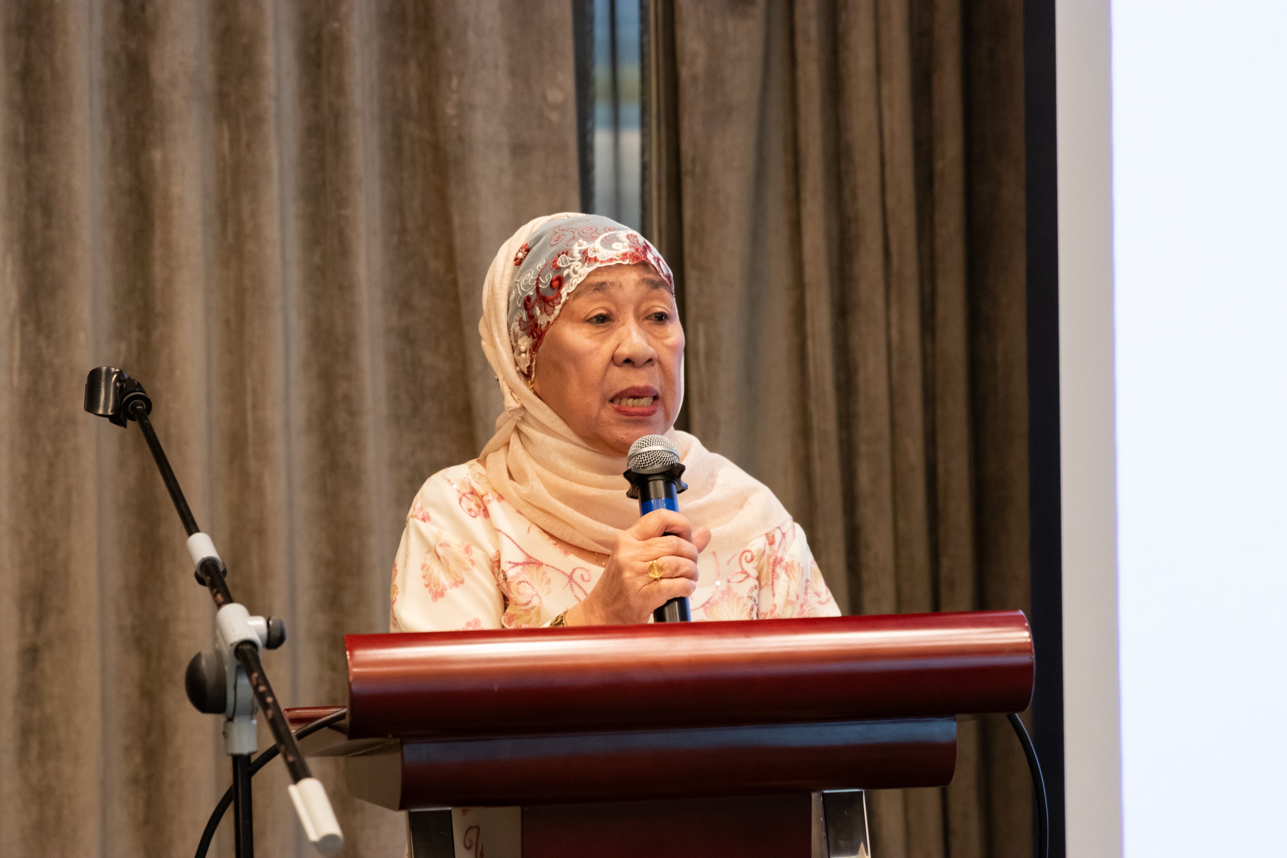 Dalisay Macadawan, Officer-in-charge, National Commission on Muslim Filipinos, speaking on a podium