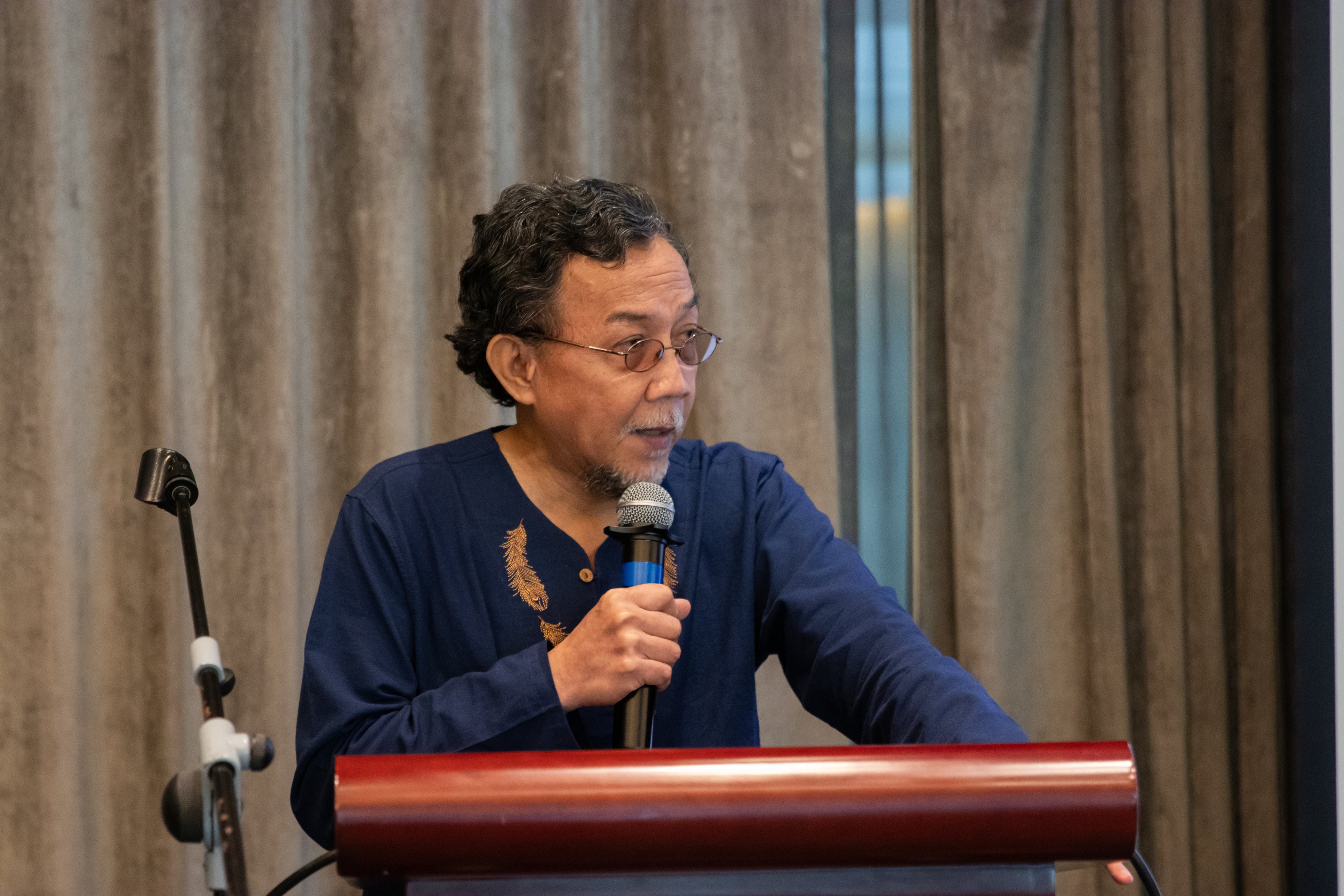 Prof. Julkipli Wadi, Dean, Institute of Islamic Studies, University of the Philippines - Diliman speaking on a podium