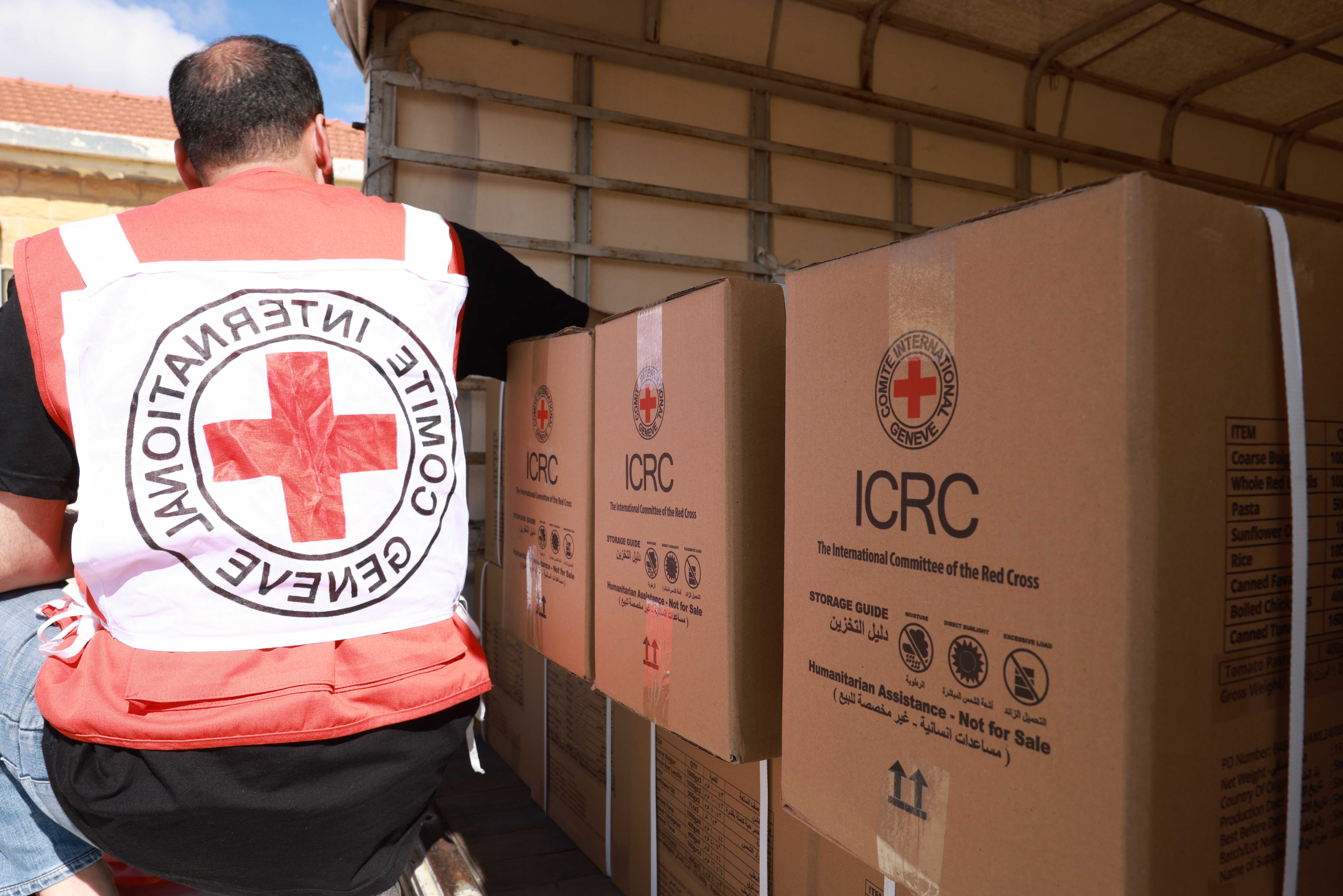 The International Committee of the Red Cross (ICRC) team distributing food parcels.