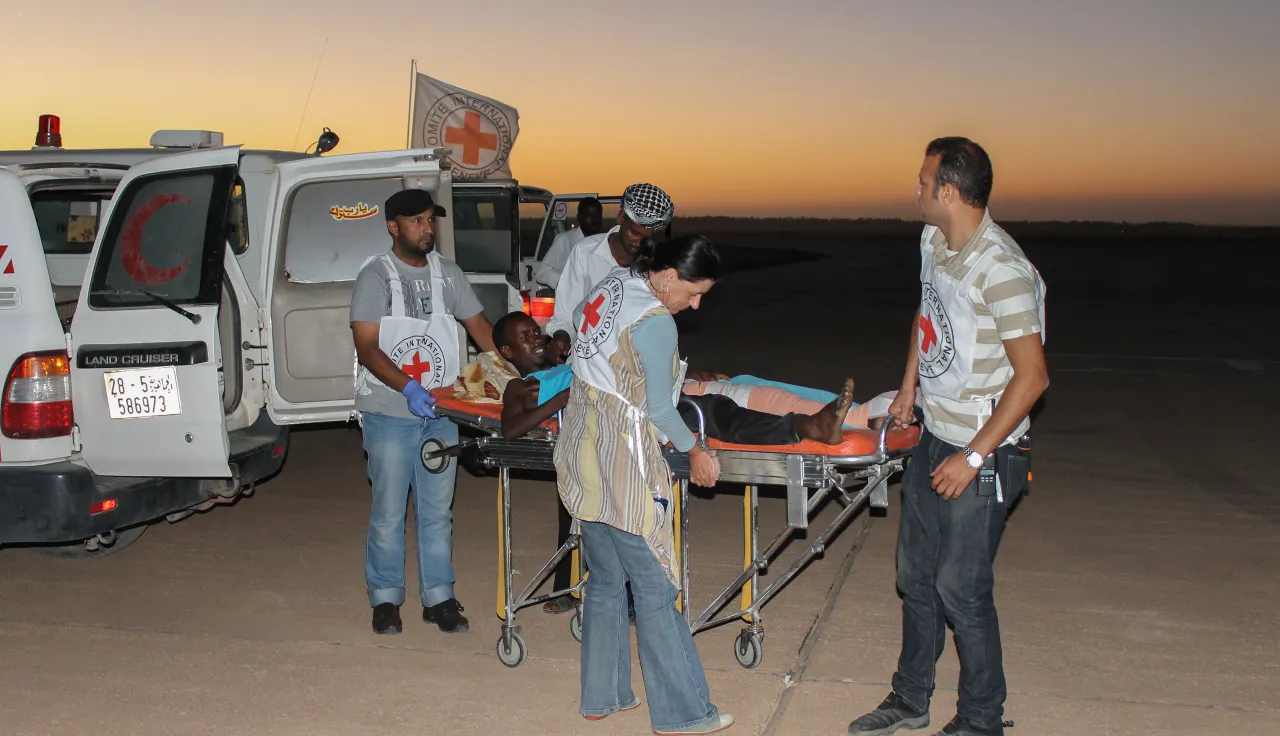 Following clashes in the region, ICRC staff evacuate wounded patients to various hospitals in Tripoli in Libya.