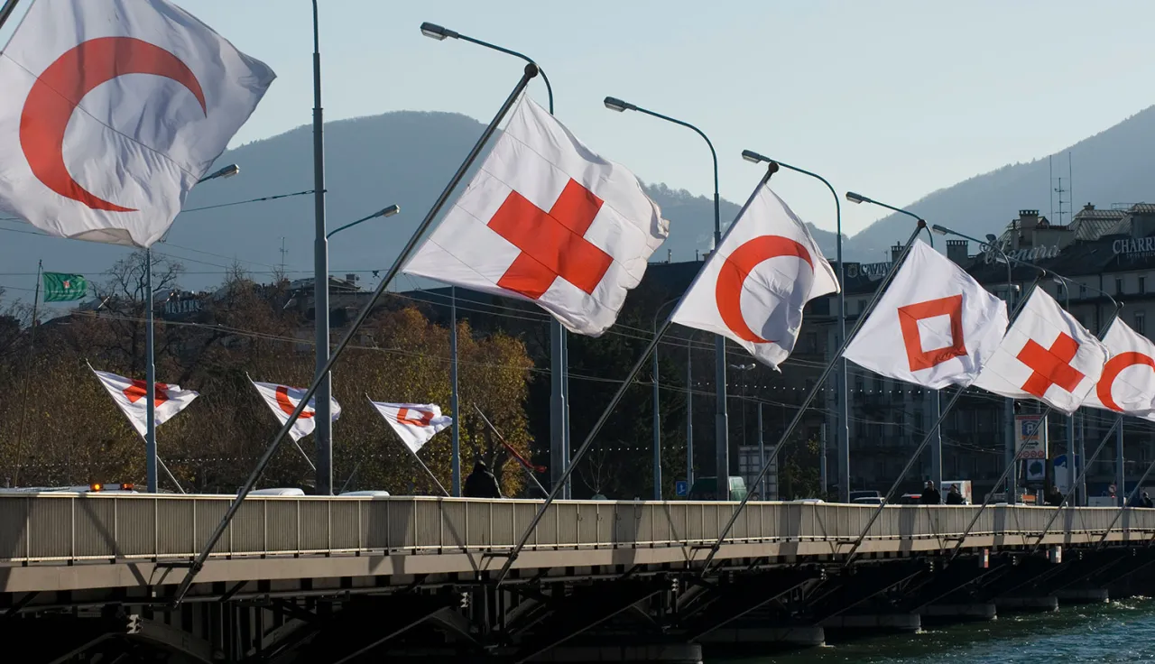 Flags fly at the Mont-Blanc bridge in Geneva, marking the 30th International Conference of the Red Cross and Red Crescent.