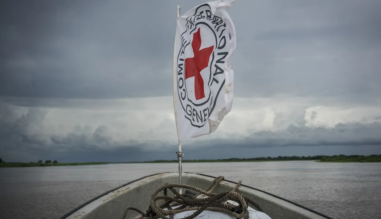 The ICRC flag whips in the wind on the river Nile.