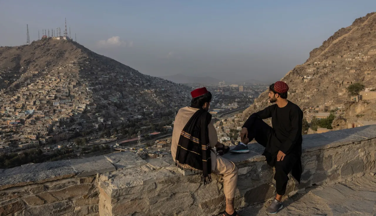 Two men with a view over the city of Kabul.