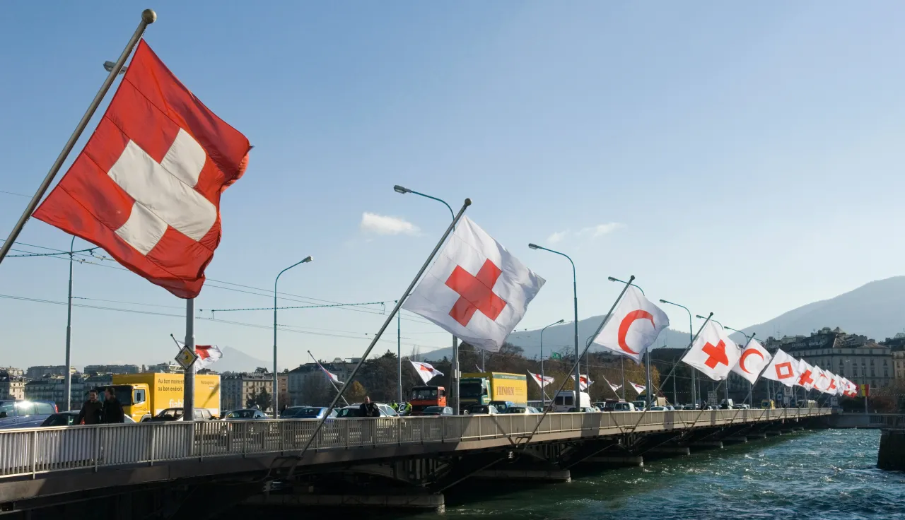 Flags fly at the Mont-Blanc bridge in Geneva, marking the 30th International Conference of the Red Cross and Red Crescent.