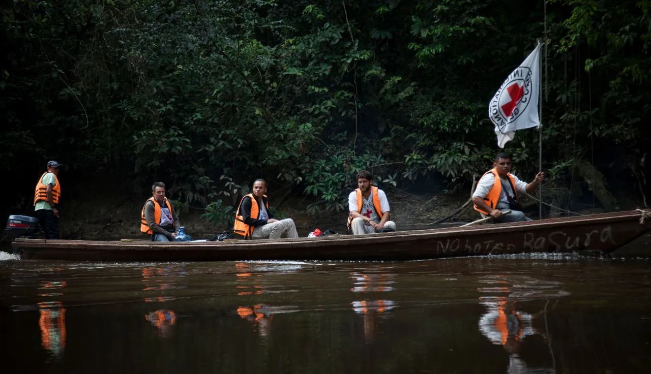 Piñuña Negro river. ICRC President, Peter Maurer, and an ICRC team on the way in pirogue to some nearby small communities in FARC controlled zone.