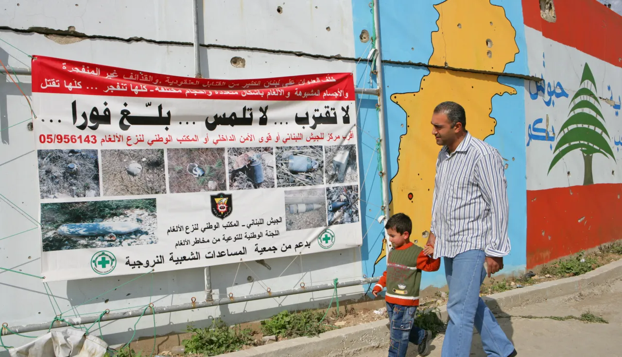 Sign warning about cluster sub-munitions and unexploded ordnance in South Lebanon.