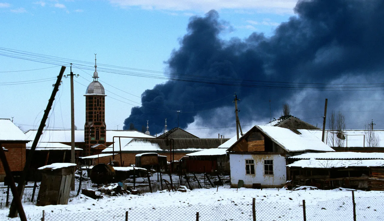Oil refinery on fire in the outskirts of Grosny (Russia) as result of bombing raid.