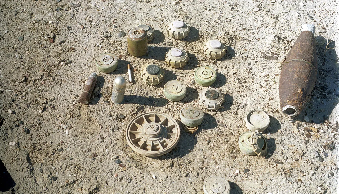 Various antipersonnel mines, 40mm grenade and part of mortar shell in Iraq.