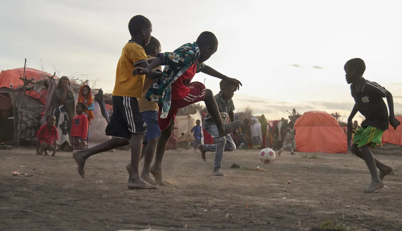 Children play with a ball in Beledweyne, Rasmi camp.