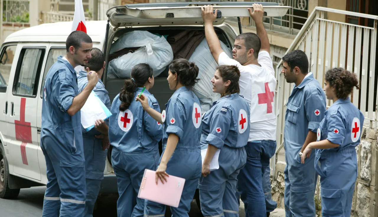 Loading of the Lebanese Red Cross minivan for the distribution of ICRC hygiene kits and blankets,