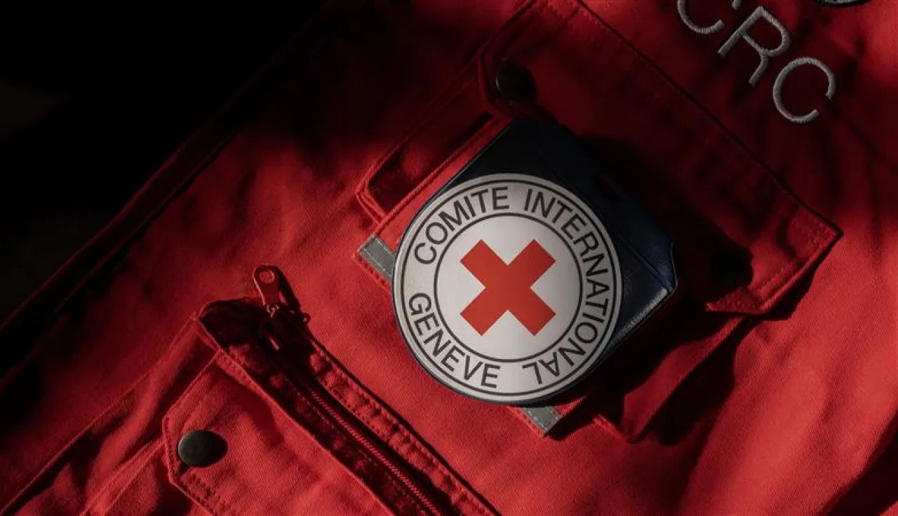 Close-up of red ICRC vest with ICRC emblem on the pocket Close-up of red ICRC vest with ICRC emblem on the pocket