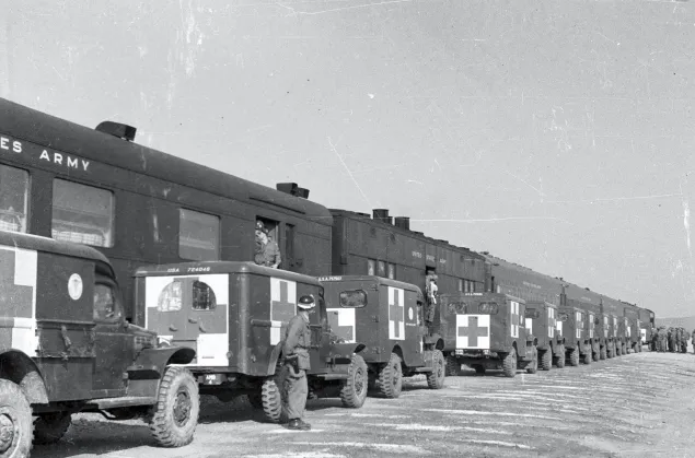 Trains and ambulances awaiting POW exchange in Munsan