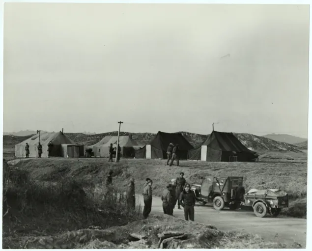 Armistice negotiations at Panmunjom. Arrival of a jeep loaded with medical supplies for prisoners of war held by North Korean forces (16 January 1952)