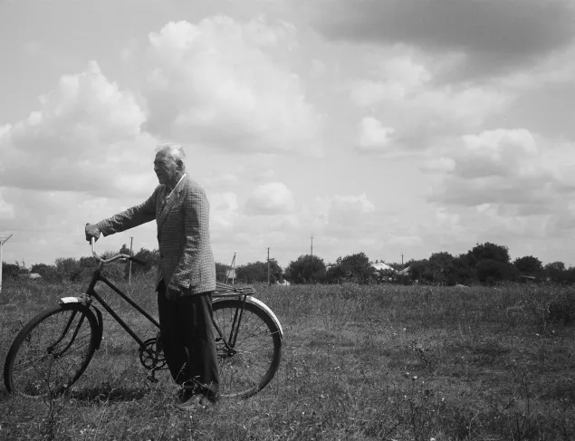 Petro with his bike in the field.