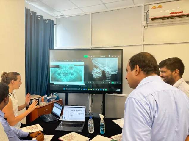 A forensic expert, facilitated by the ICRC, conducting a workshop on forensic anthropology with a focus on age estimation.