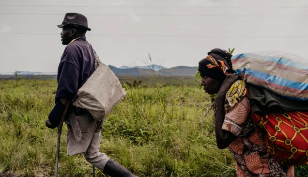 A family flees to the city of Goma. Artillery impacts could be heard behind the fleeing civilians.