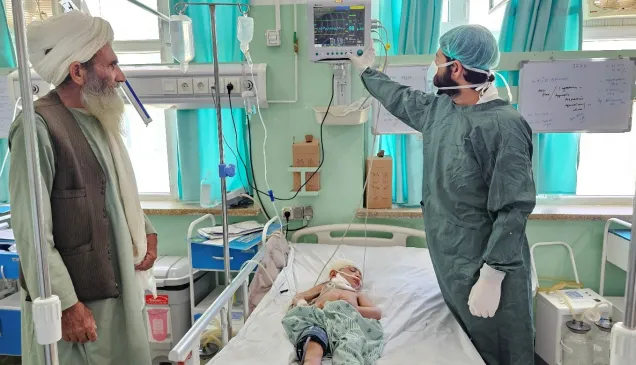 A doctor at the Mirwais Regional Hospital’s Intensive Care Unit (ICU) ward checks the patient monitoring machine