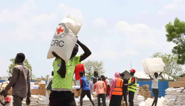 ICRC staff supplying essential items to refugees.