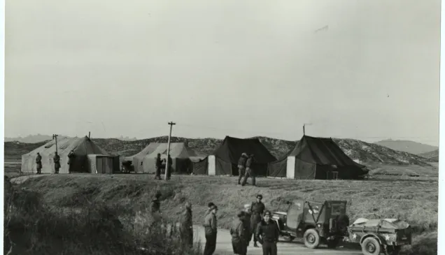 Armistice negotiations at Panmunjom. Arrival of a jeep loaded with medical supplies for prisoners of war held by North Korean forces (16 January 1952)