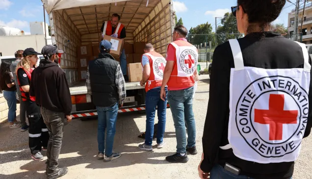 ICRC staff in Lebanon unloading aids from a truck.