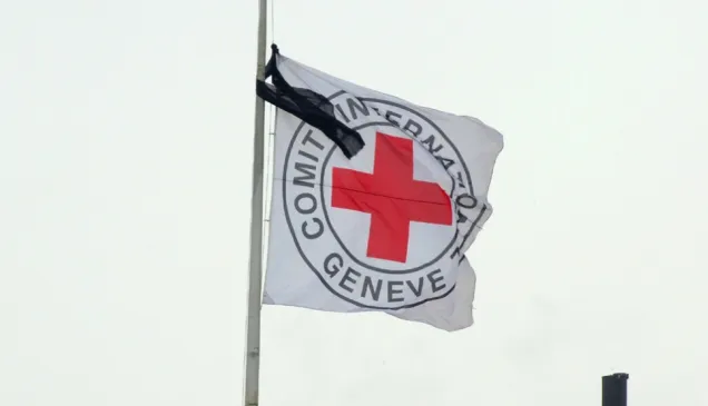 ICRC flag with black ribbon attached