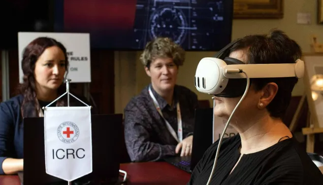 A lady uses a virtual reality headset