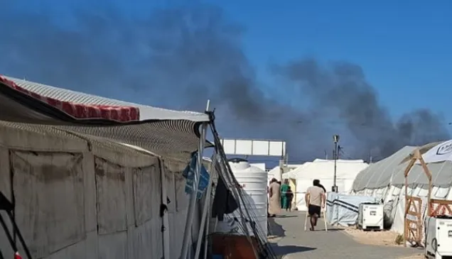 Photo from the Red Cross Field Hospital in Rafah, Gaza. Smoke in the background