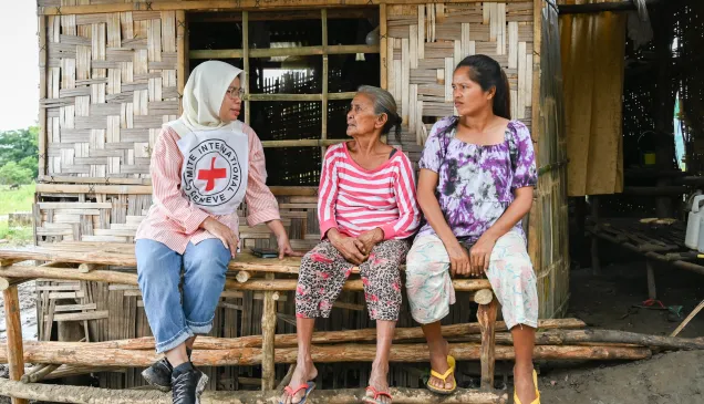 ICRC protection field officer Raidah Latip talks with conflict-affected people in Maguindanao del Sur