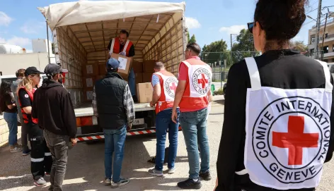 ICRC staff in Lebanon unloading aids from a truck.