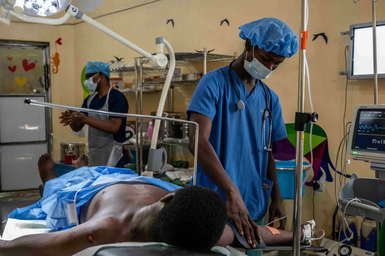 A man injured by an explosive device is prepared for surgery. A man injured by an explosive device is prepared for surgery.