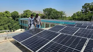 ICRC Water and Habitat staff inspecting the newly installed solar hybrid power system at Mirwaid Regional Hospital in Kandahar