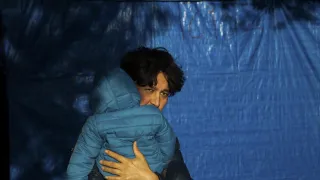 Afghan father and his child outside their makeshift tent in Moria Refugee camo in Lesbos.