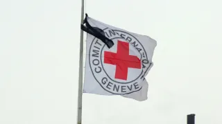 ICRC flag with black ribbon attached