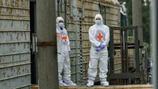 CREDIT: Coordination Headquarters for Treatment of Prisoners of War Two ICRC delegates in protective clothing