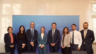 A group photo of eight representatives from the ICRC and Luxembourg MFA.