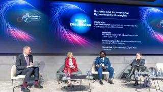 four people sitting on a panel