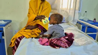 A malnourished child receives therapeutic milk during treatment at the stabilization centre in Damaturu.