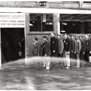 World War II. Drancy. Camp for Jewish civilian internees. Waiting in front of the kitchen at mealtime. Copyright ICRC