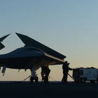 Northrop Grumman personnel conduct preoperational tests on a U.S. Navy X-47B Unmanned Combat Air System demonstrator aircraft.