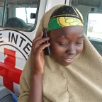 Dadaab refugee camp, Kenya. A Somali woman phones a relative. This is made possible by the ICRC's mobile phone service. ICRC A Somali woman phones a relative in Dadaab refugee camp, Kenya.