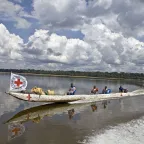An ICRC team travels by pirogue to Balombe, on the Oubangui River, to distribute cassava cuttings, farming equipment, and fishing supplies in the Democratic Republic of the Congo. Jonathan TORGOVNIK/ICRC An ICRC team travels by pirogue to Balombe to distribute farming equipment and fishing supplies in the Democratic Republic of the Congo.