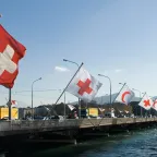 Flags fly at the Mont-Blanc bridge in Geneva, marking the 30th International Conference of the Red Cross and Red Crescent.