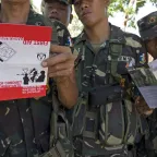 Members of an armed force group during an ICRC briefing on international humanitarian law.