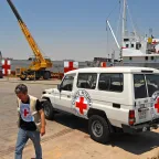 A ship used to transport relief aid from Cyprus to Lebanon in Larnaka harbour bears the red cross emblem.
