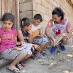 Tovuz. The ICRC distributes flyers to children to inform them on the danger of landmines. Aida Aliveya/ICRC The ICRC distributes flyers to children to inform them on the danger of landmines in Tovuz, Azerbaijan.