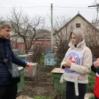 ICRC staff interviews man on beekeeping in the cash-for-livelihood programme in Moldova. ICRC