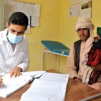 A healthcare worker providing consultation to a patient in Farah, Afghanistan