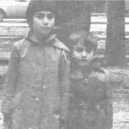 Khonelia Aida and Eduard standing together as children